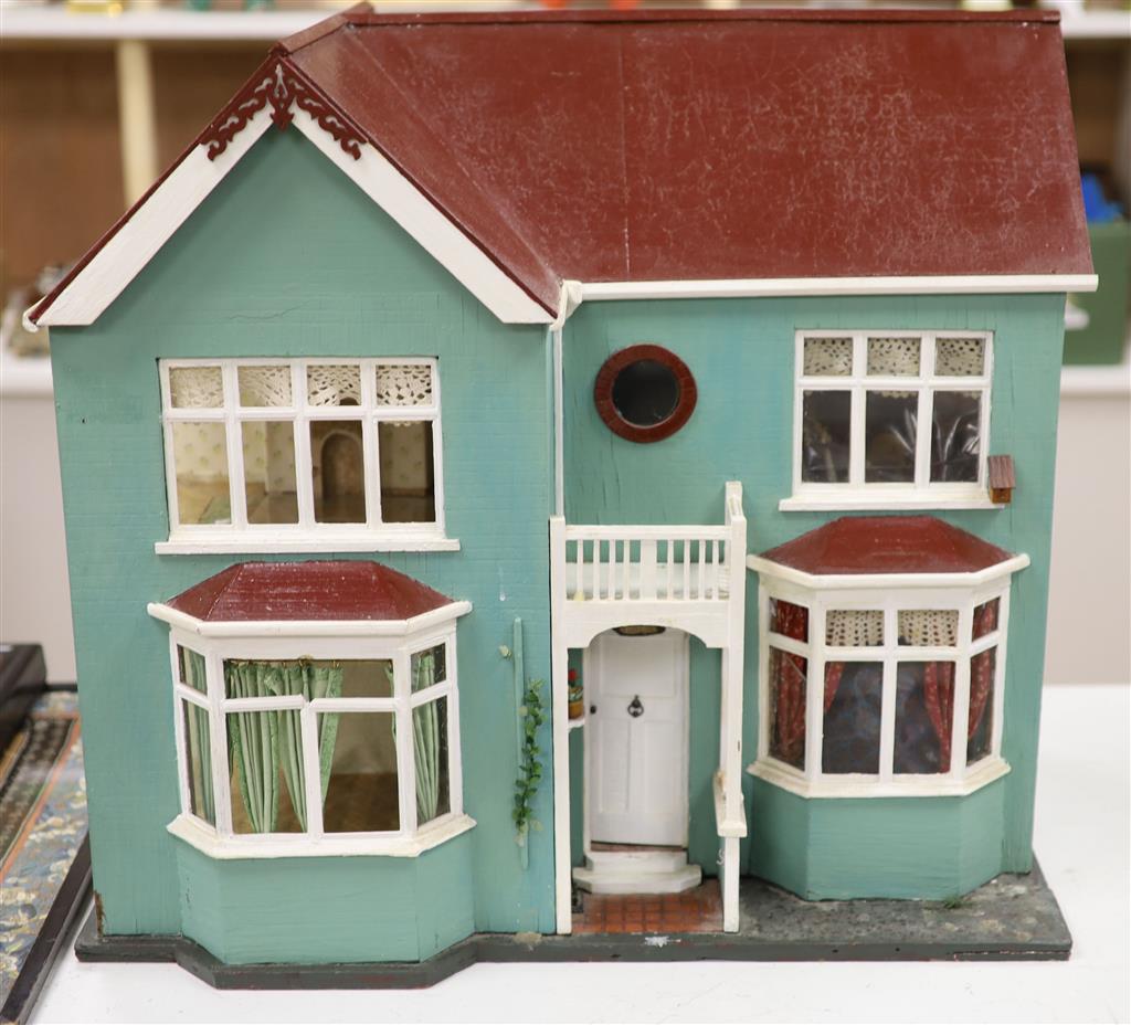 A 1940s dolls house, with contents from Compton Verney Warwickshire, width 63cm height 60cm